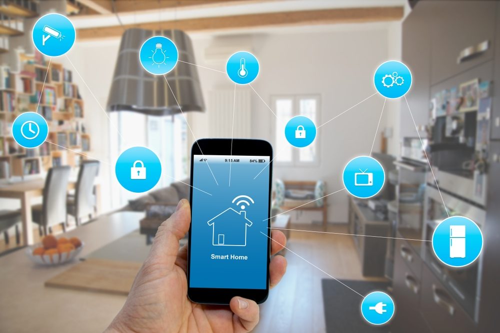 Smart,Home,Concept,,Hand,Holding,Smartphone,With,Smart,Home,Application